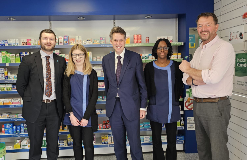 Sir Gavin Williamson is joined by staff in Northwood Pharmacy 