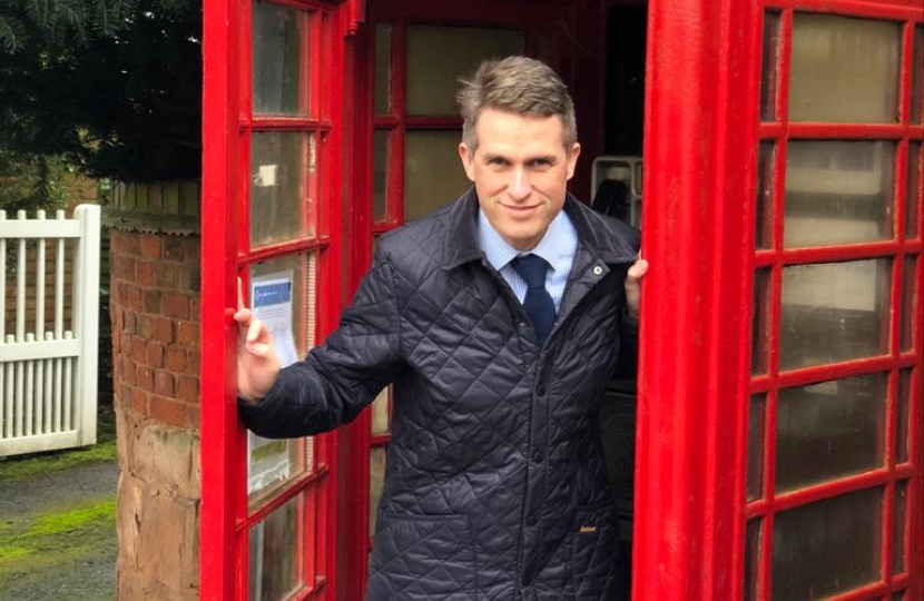 Gavin Williamson MP, standing in the historical phone box in Oaken