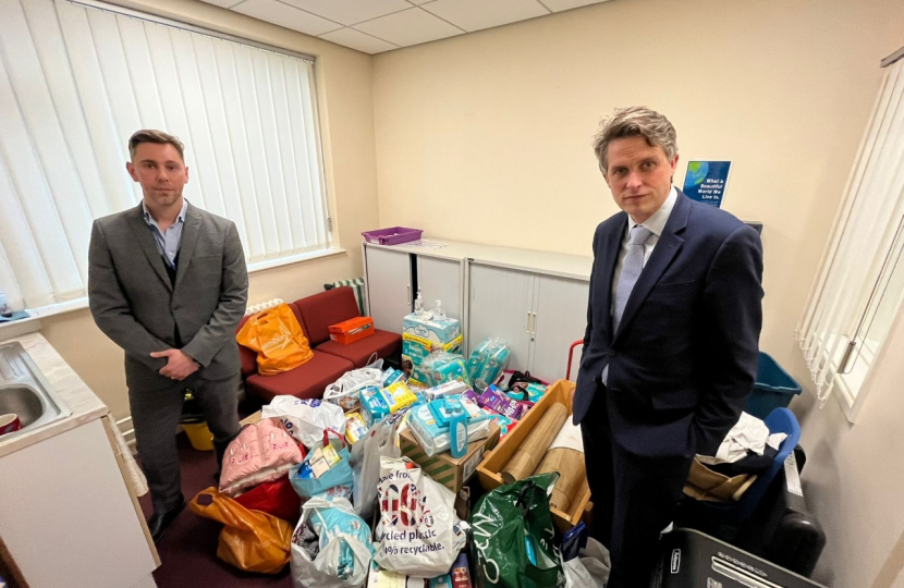 Tom Wright, Headmaster, and Gavin next to all the donations for Ukraine