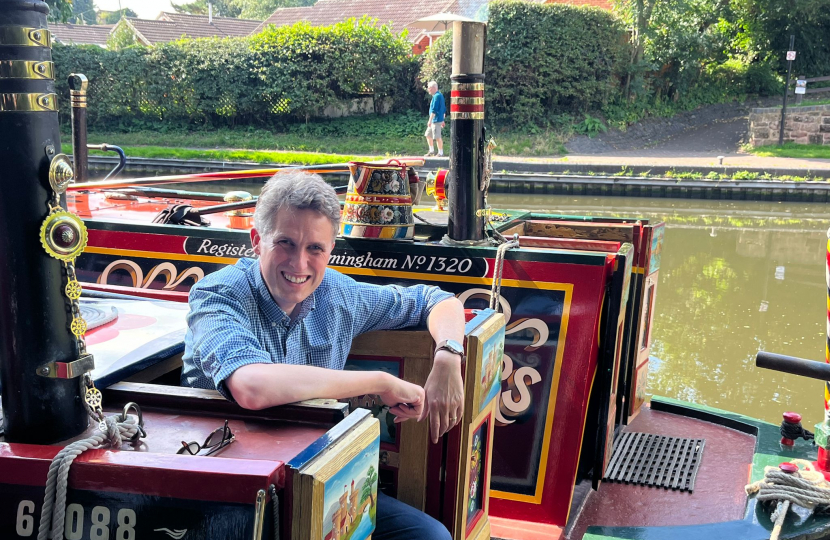 Sir Gavin Williamson smiling on board a Staffordshire narrowboat