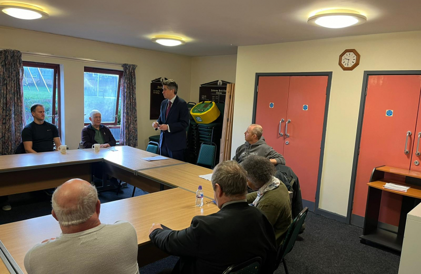 Sir Gavin Williamson leading a meeting with residents living nearby the proposed facility