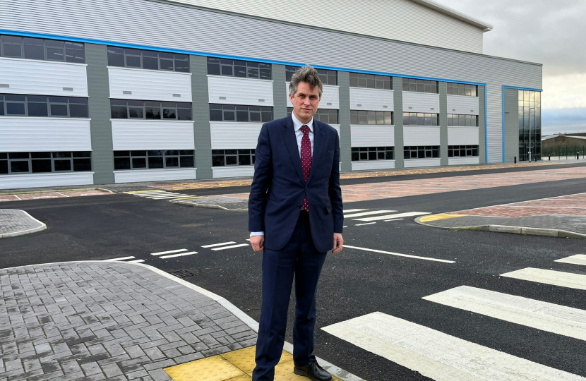 Sir Gavin Williamson standing outside the controversial distribution warehouse developments near Stone