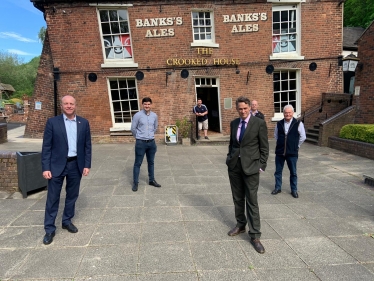 Gavin Williamson and Marco Longhi MP with campaigners at the Crooked House Pub in Himley