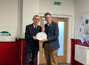 Sir Gavin Williamson is presented with a plate by John McDermott, the President of Staffordshire RFU